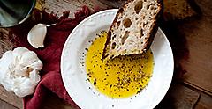 Bread with olive oil seasoned with herbs. Mediterranean