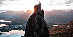 View of two People Rock Climbing to the Top of Lofoten. Norway