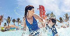 Perfect Day at Coco Cay Mother Daughter Enjoying thee Wave Pool