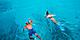 Bonaire Couple Snorkeling in Clear Blue Ocean