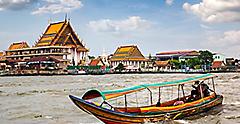Boat traveling via the Chao Phraya River. Bangkok Thailand.