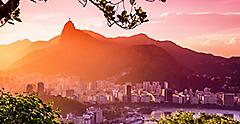 sunset view of the city of Rio with Christ de Redeemer statue 