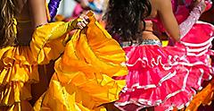 Carnival costumes dancing in bright sunlight in Rio de Janeiro, Brazil