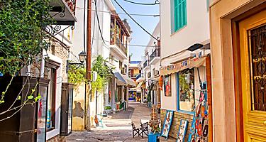 A back street lined with shops in Skiathos, Greece. 