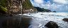  black sand beach with waterfall at Wavine Cyrique in Dominica. The Caribbean.