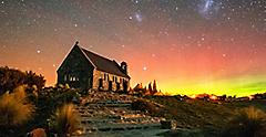 old brick church at night in the winter with the Southern Lights. Australia.