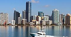view of Miami and Biscayne Bay from the Key Biscayne Bridge with fishing boat. Florida.