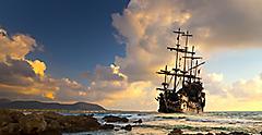 Pirate ship sailing into the sunset. Transatlantic.